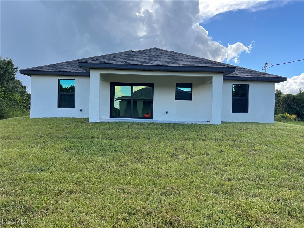 6108 Holt Court Fort Myers, FL 33905 - Photo 3 of 19 a front view of a house with garden