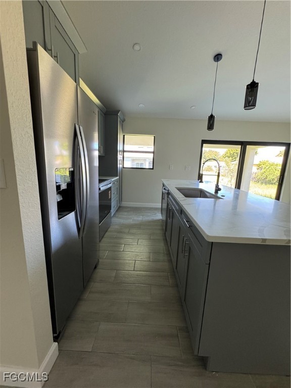 6108 Holt Court Fort Myers, FL 33905 - Photo 7 of 19 a kitchen with stainless steel appliances granite countertop a refrigerator a sink a stove and island