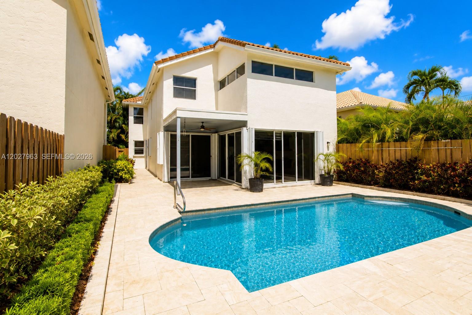 6646 Northwest 25th Terrace Boca Raton, FL 33496 - Photo 36 of 48 a view of a house with pool and sitting area
