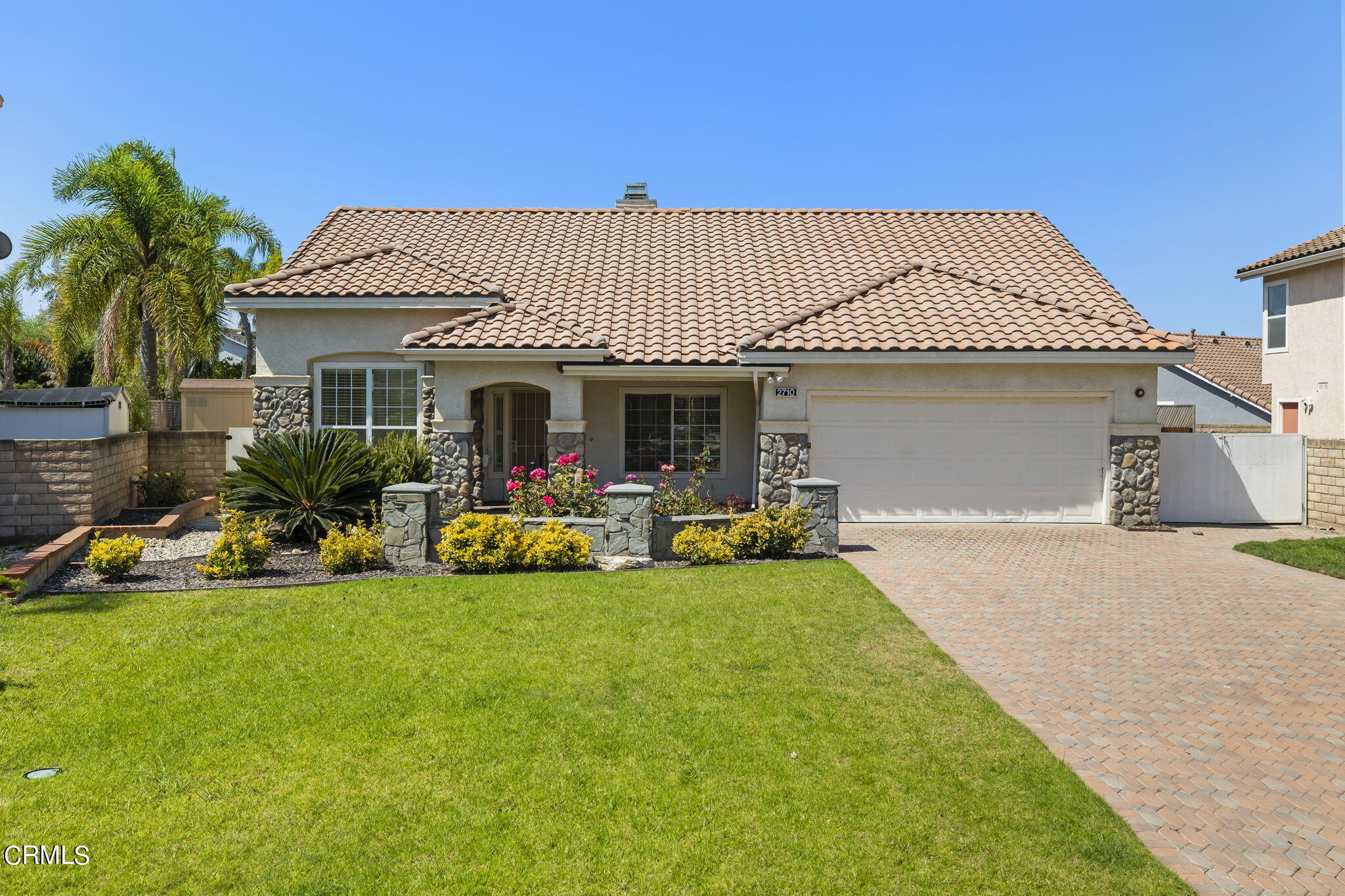 a view of a house with backyard porch and sitting area