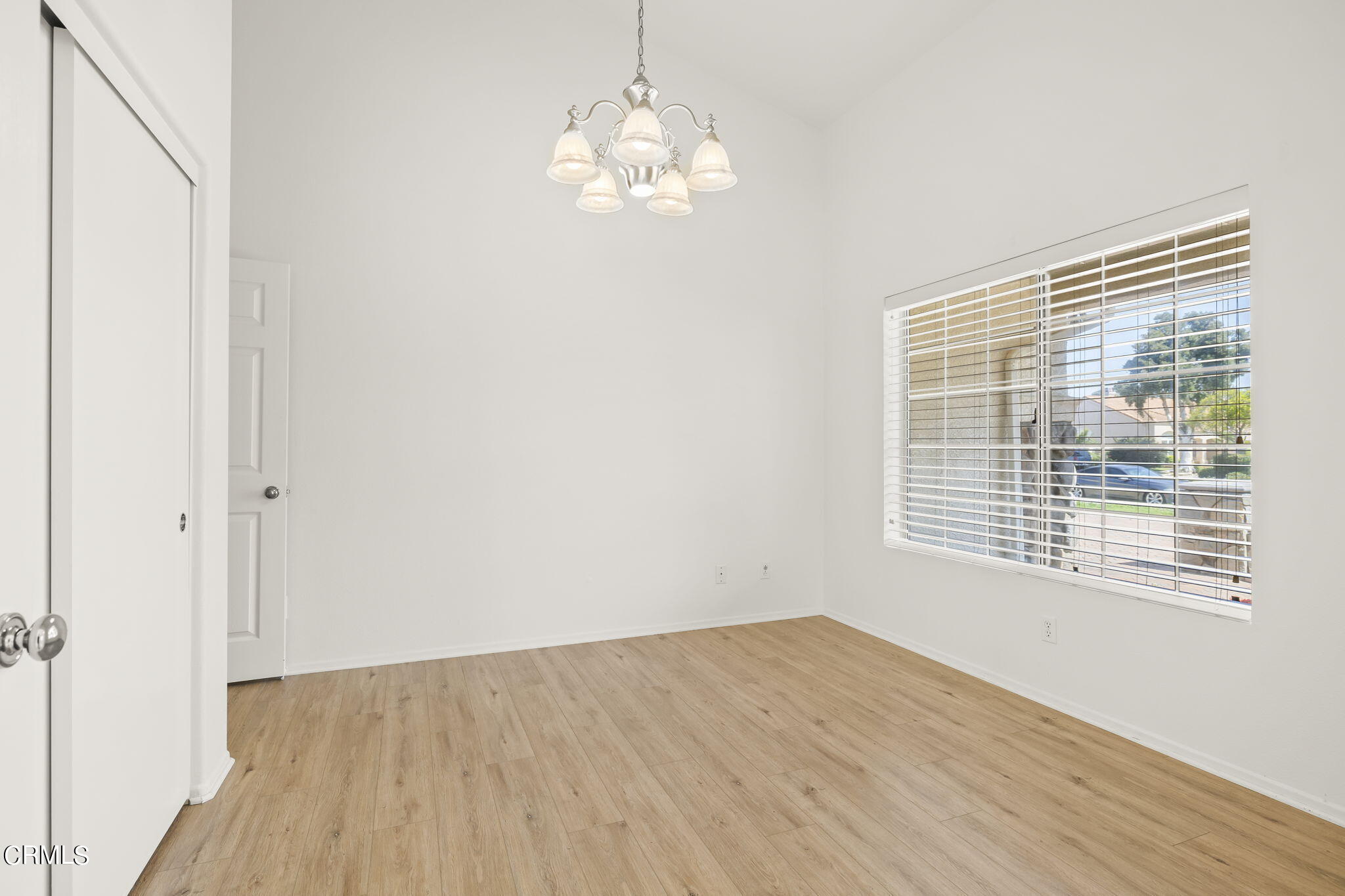 2710 Windcrest Place Oxnard, CA 93036 - Photo 19 of 34 a view of an empty room with wooden floor and a window