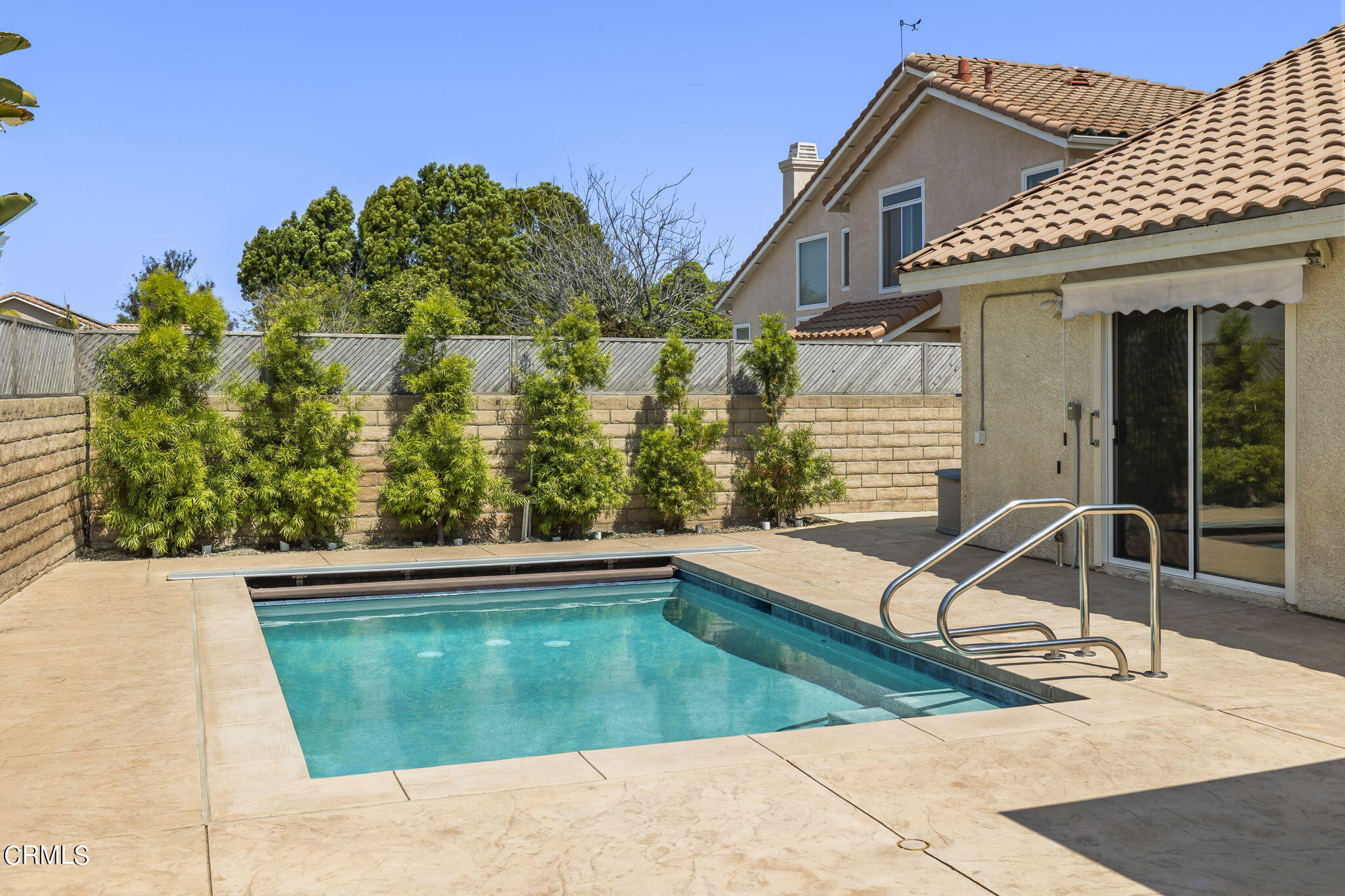 2710 Windcrest Place Oxnard, CA 93036 - Photo 23 of 34 a view of a swimming pool with chairs
