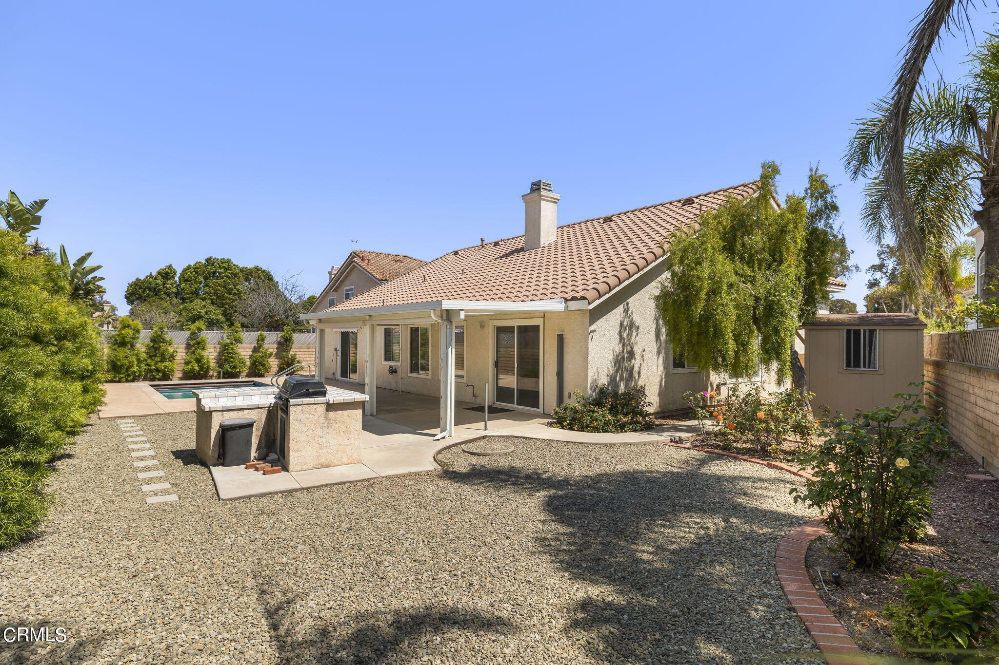 2710 Windcrest Place Oxnard, CA 93036 - Photo 28 of 34 a front view of a house with a garden