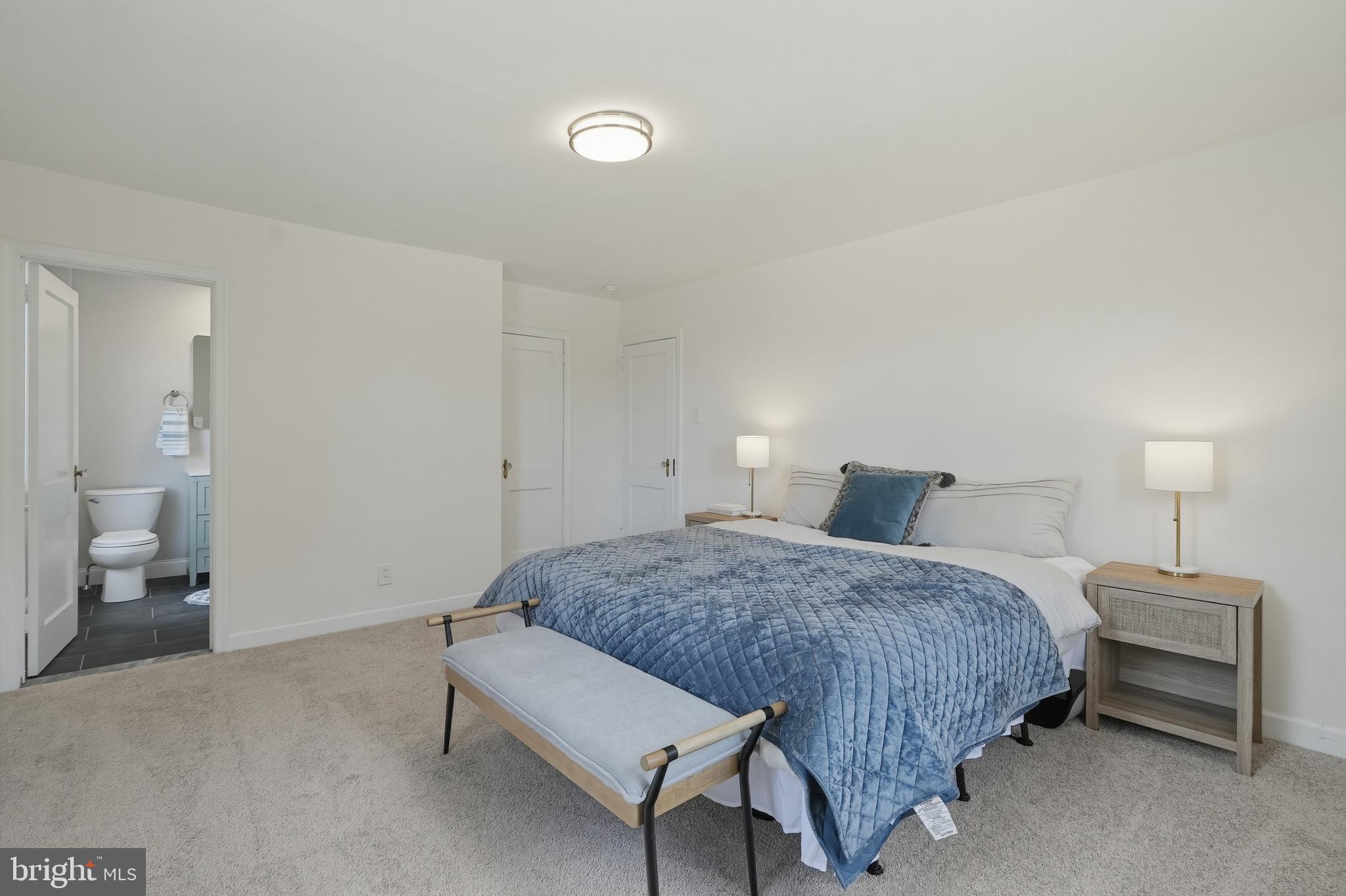 800 Pleasant Hill Road Wallingford, PA 19086 - Photo 21 of 34 a bedroom with a bed and a lamp