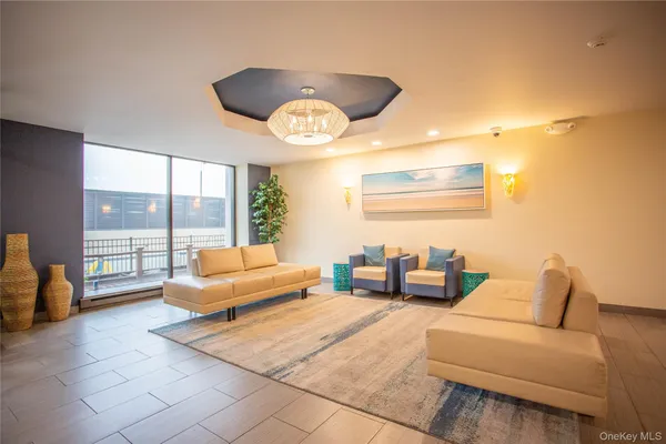 a living room with furniture and a large window