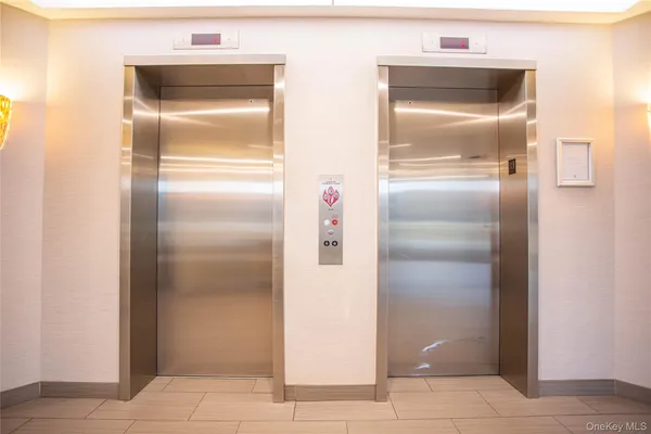 a kitchen with a refrigerator and an entrance