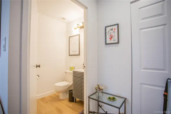 a bathroom with a toilet and a shower curtain