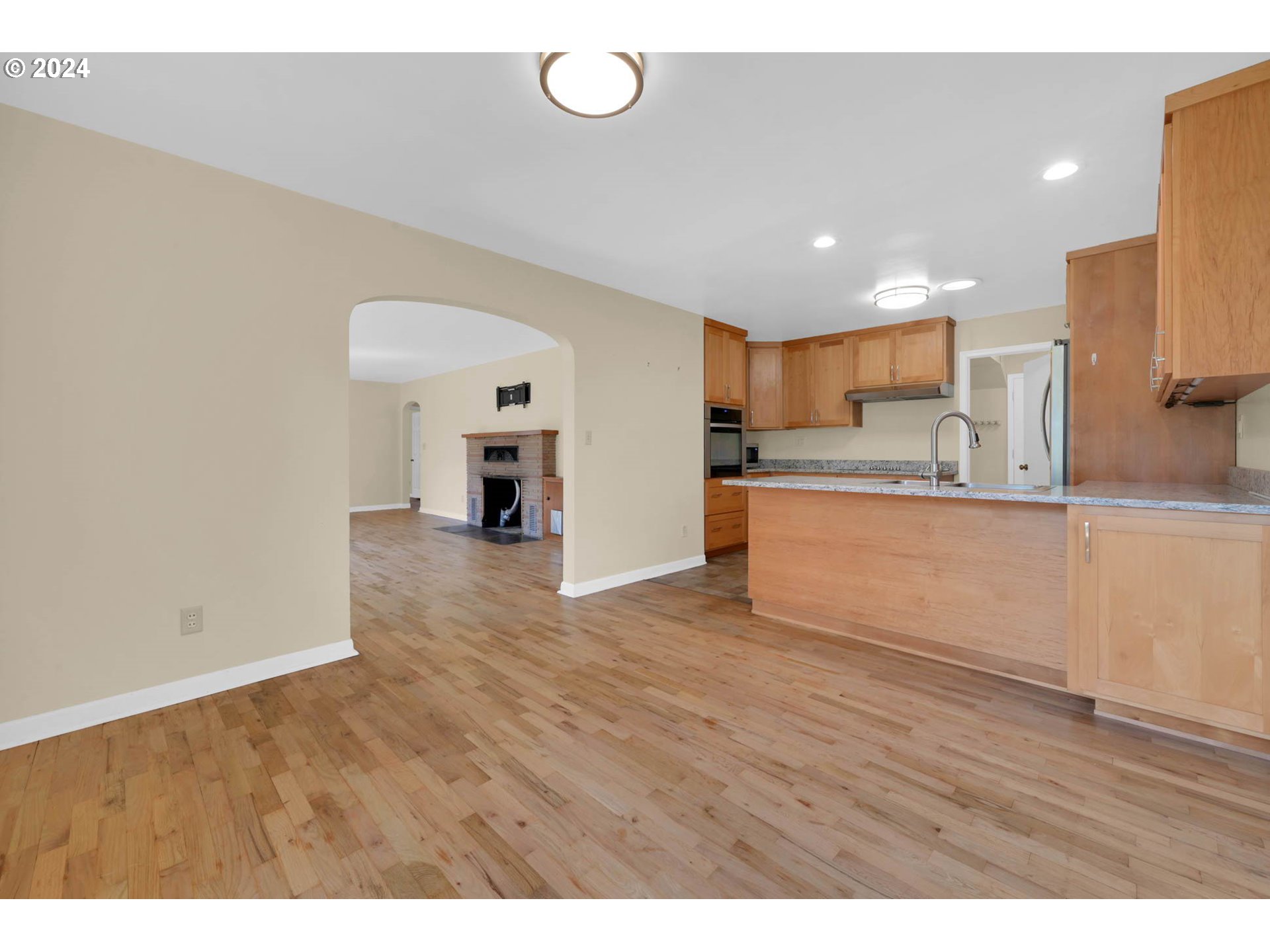 1427 Anderson Lane Springfield, OR 97477 - Photo 12 of 48 a kitchen with stainless steel appliances granite countertop a sink a stove a microwave and island