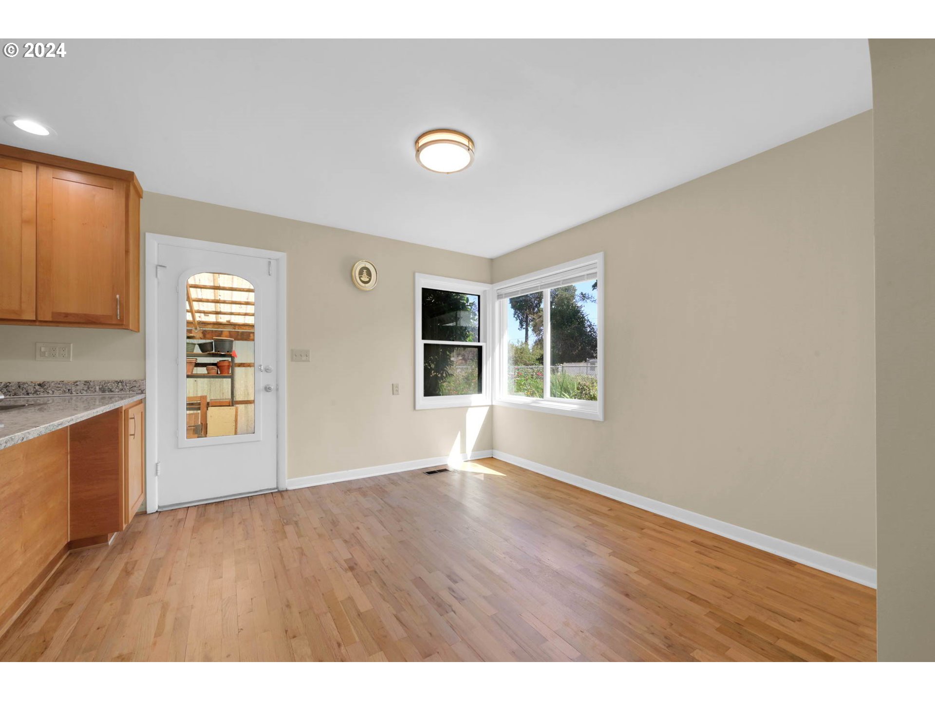 1427 Anderson Lane Springfield, OR 97477 - Photo 13 of 48 a view of an empty room with window and wooden floor
