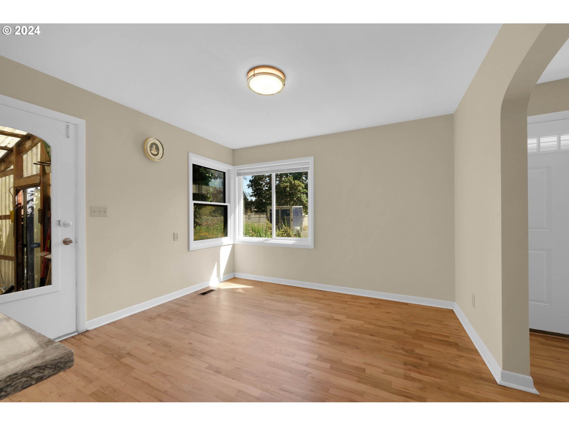 1427 Anderson Lane Springfield, OR 97477 - Photo 14 of 48 a view of an empty room with wooden floor and a window