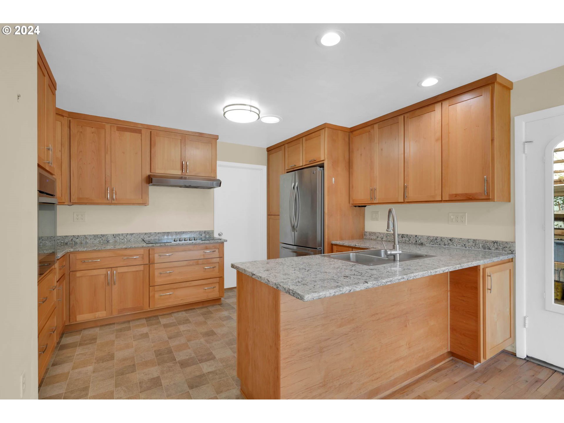 1427 Anderson Lane Springfield, OR 97477 - Photo 16 of 48 a kitchen with kitchen island granite countertop a sink cabinets and stainless steel appliances