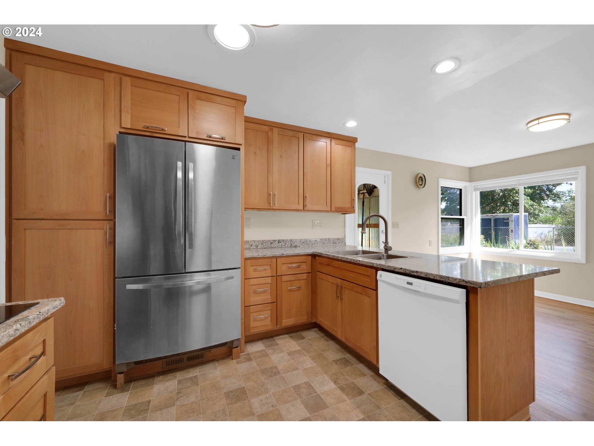 1427 Anderson Lane Springfield, OR 97477 - Photo 18 of 48 a kitchen with granite countertop stainless steel appliances and refrigerator