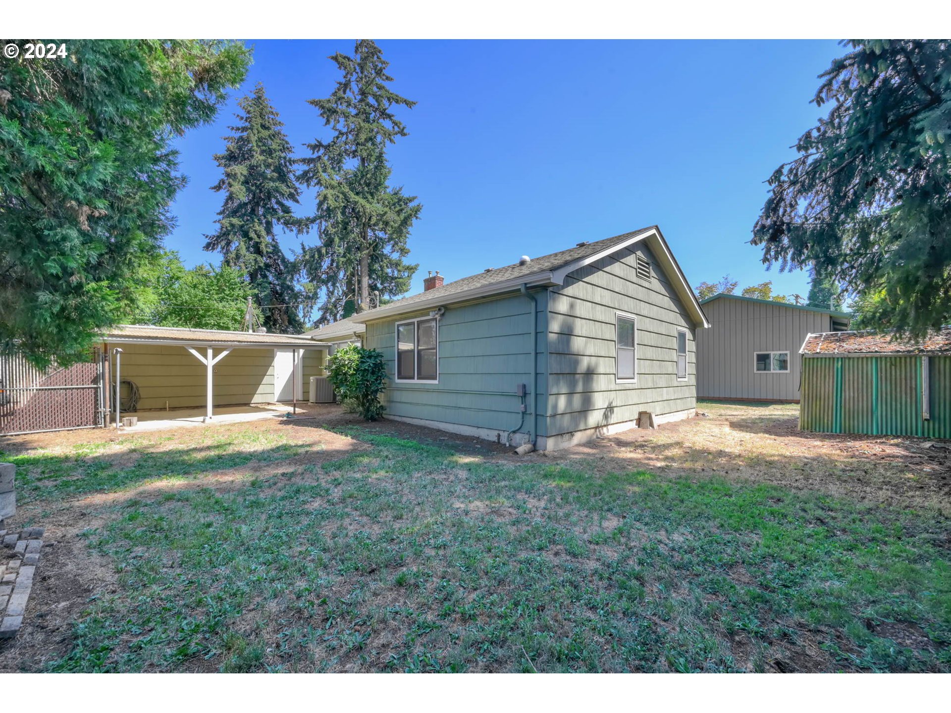 1427 Anderson Lane Springfield, OR 97477 - Photo 36 of 48 a view of backyard of house with outdoor seating and green space