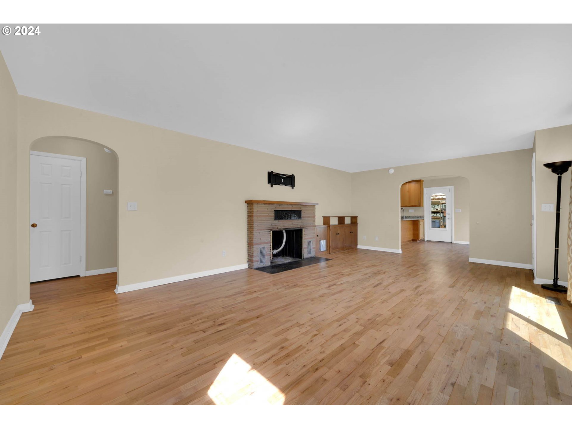 1427 Anderson Lane Springfield, OR 97477 - Photo 9 of 48 a view of empty room with wooden floor and fireplace