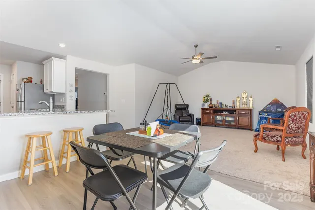a dining room with a table and chairs