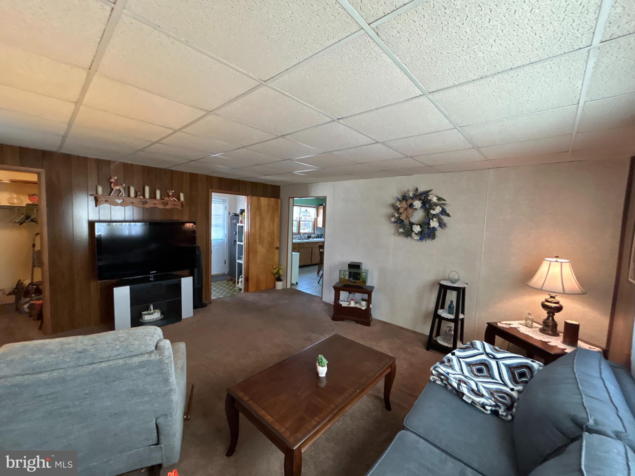 144 Annapolis Road Pennsville, NJ 08070 - Photo 18 of 24 a living room with furniture and a flat screen tv
