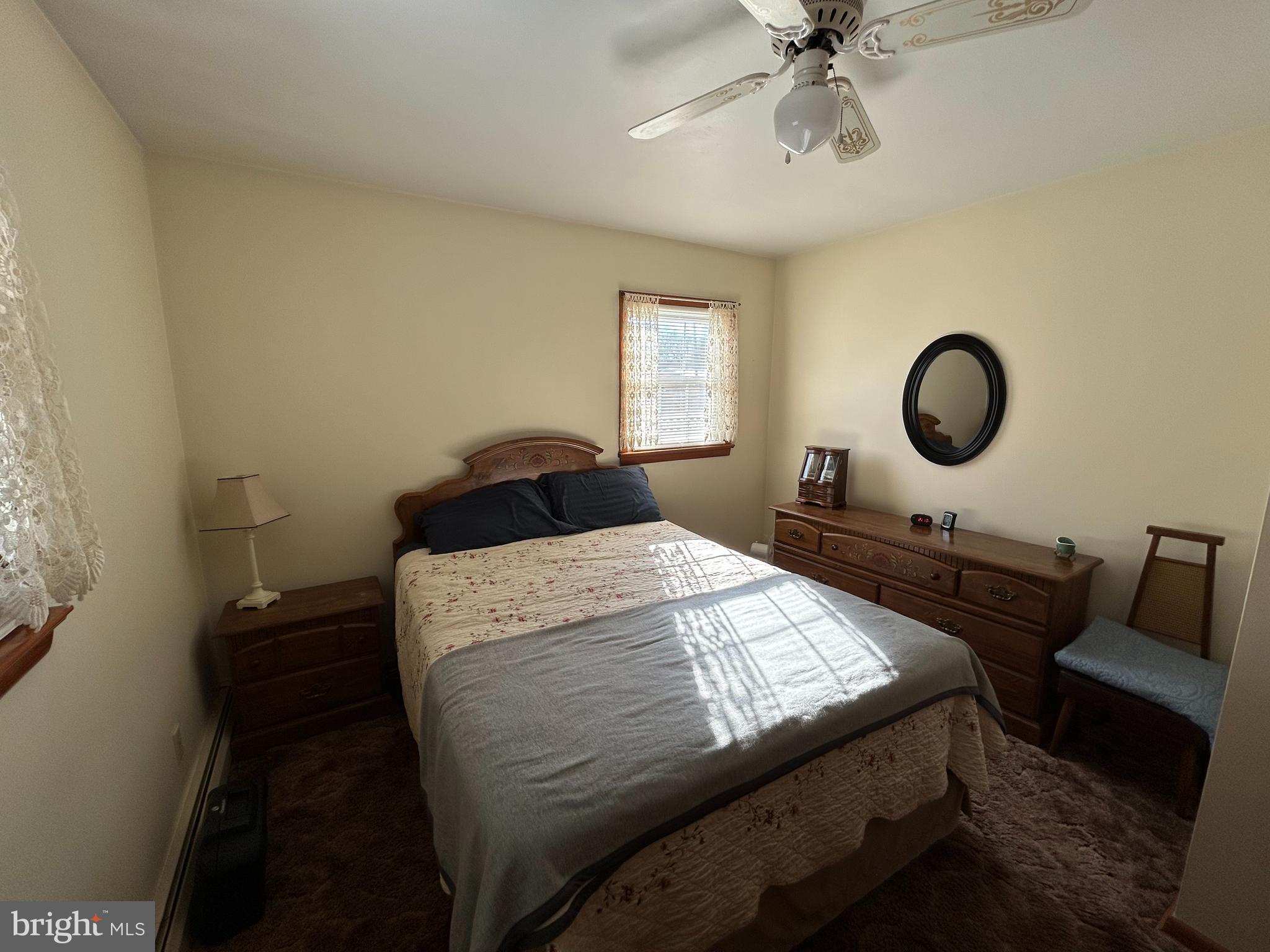 144 Annapolis Road Pennsville, NJ 08070 - Photo 8 of 24 a bedroom with a bed and window
