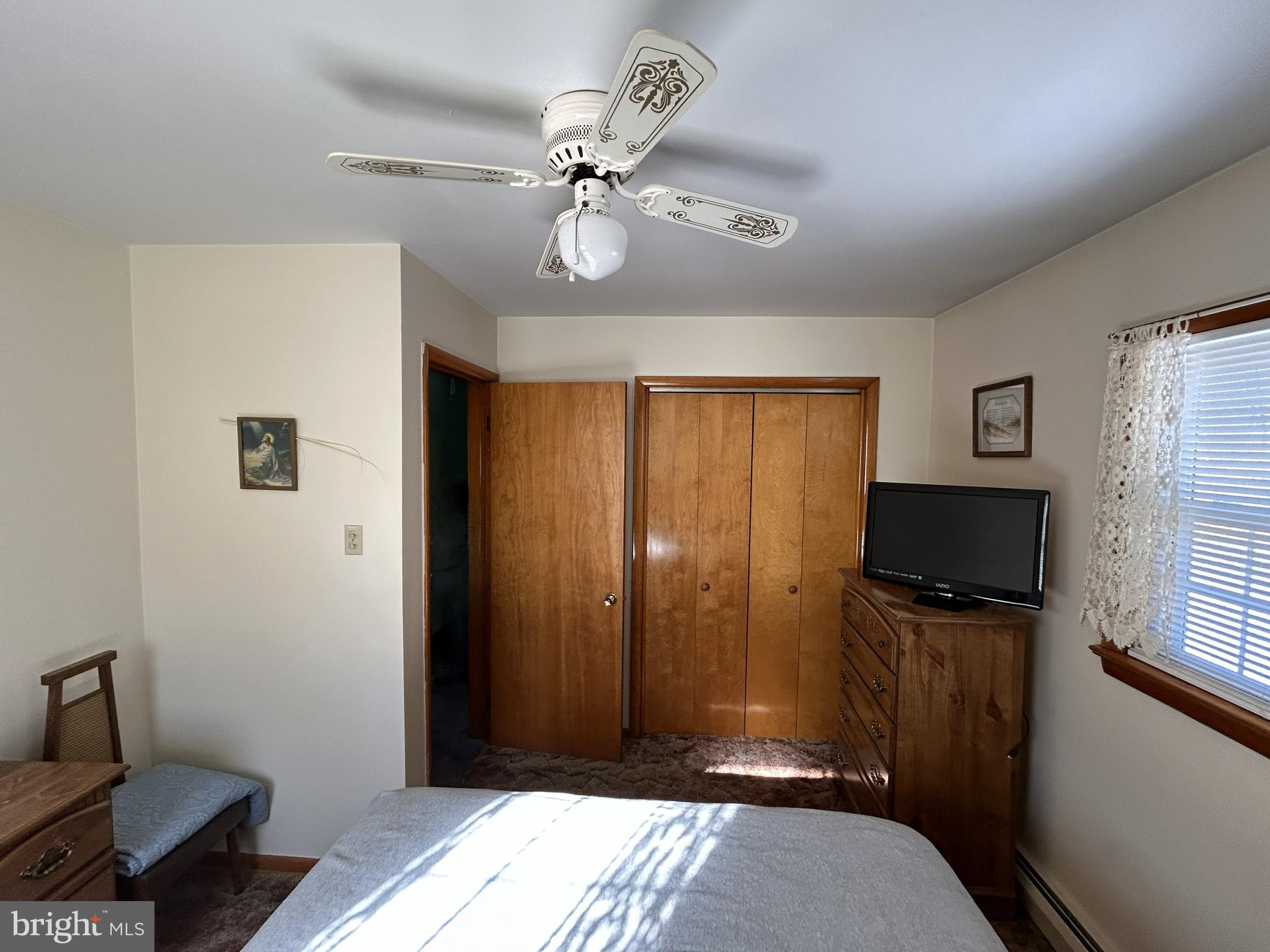 144 Annapolis Road Pennsville, NJ 08070 - Photo 9 of 24 a bedroom with a bed and wooden floor