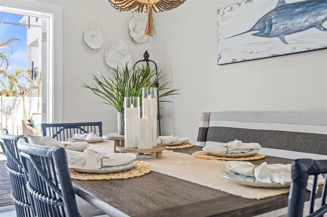 a kitchen with a stove a sink and a white cabinets