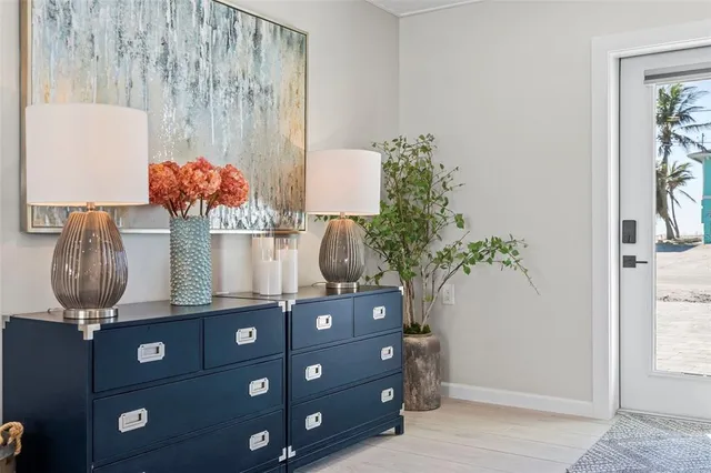 a table with a vase and flowers on it