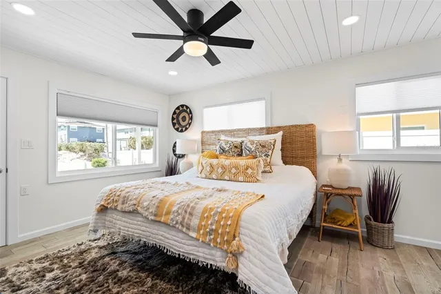 a bathroom with a sink a toilet a shower and a mirror