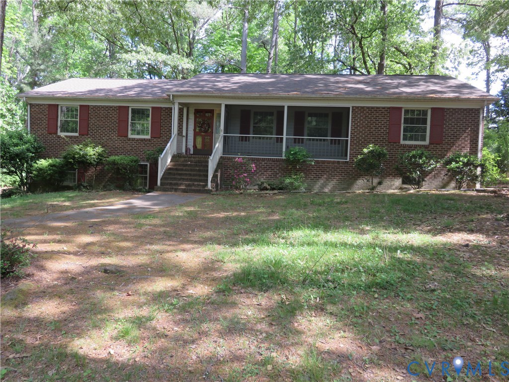 8379 Quailfield Road Mechanicsville, VA 23116 - Photo 3 of 56 a backyard of a house with yard and outdoor seating
