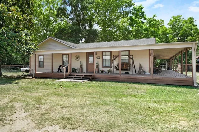 a backyard of a house with lots of green space