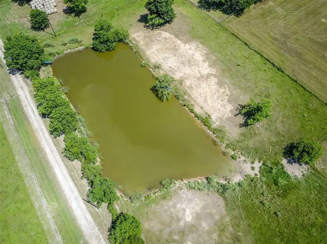 an aerial view of a residential building with outdoor space