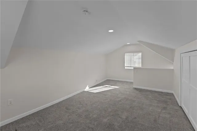 an empty room with a empty space and window