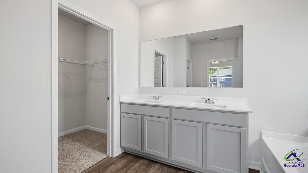 227 Cattle Drive Perry, GA 31069 - Photo 12 of 40 a bathroom with a double vanity sink and mirror
