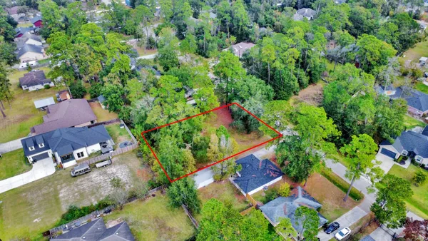 an aerial view of residential house with outdoor space and swimming pool