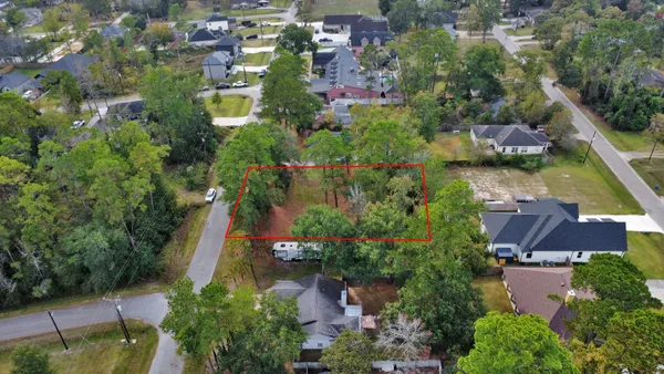 an aerial view of house with yard swimming pool and outdoor seating