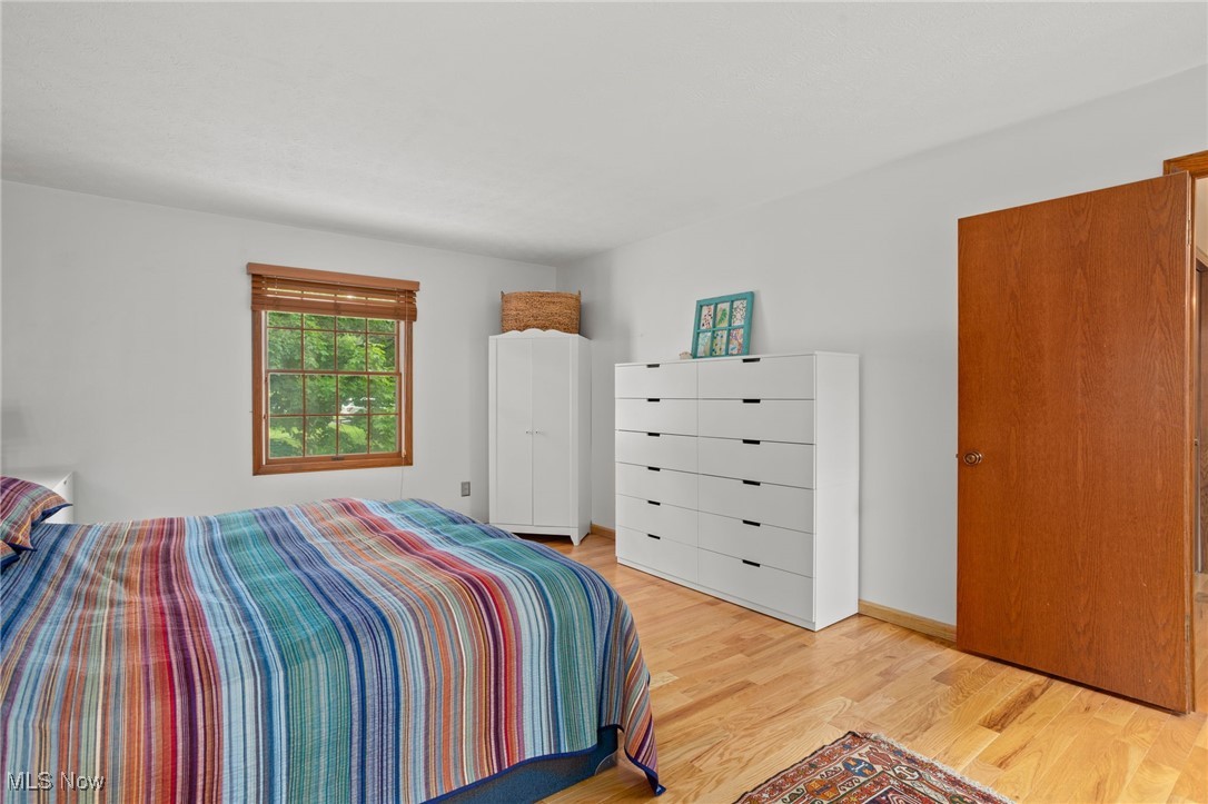 4694 Ranchwood Road Akron, OH 44333 - Photo 28 of 44 Bedroom featuring light wood-style floors