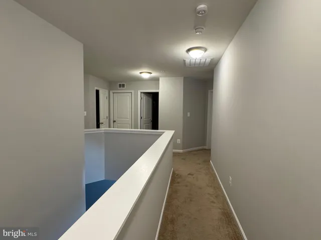 a view of hallway with a mirror
