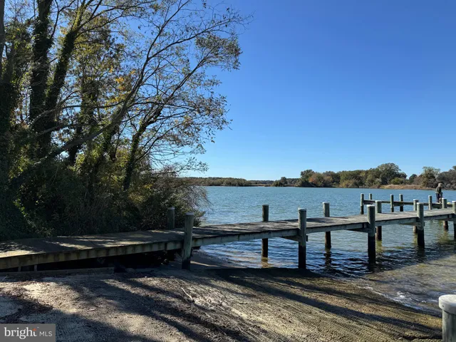 a view of a wooden deck with a lake view