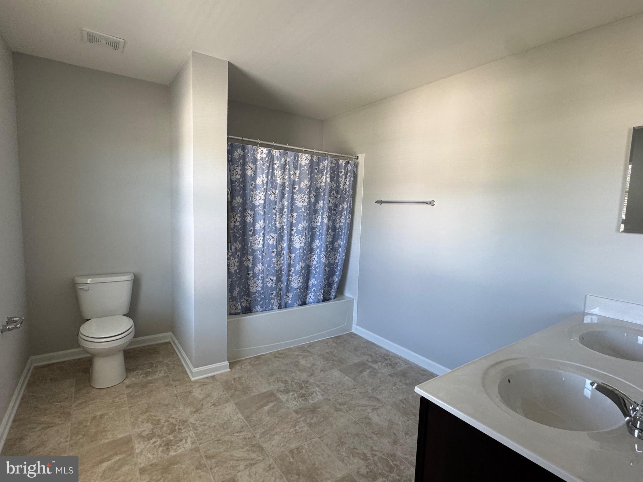 101 Albemarle Court Cambridge, MD 21613 - Photo 39 of 47 a bathroom with a toilet sink and shower