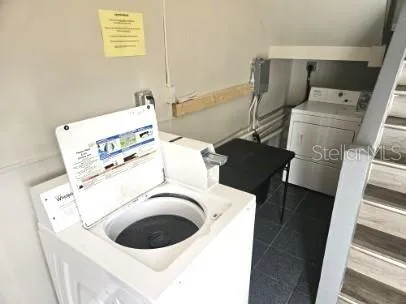 a utility room with dryer and washer