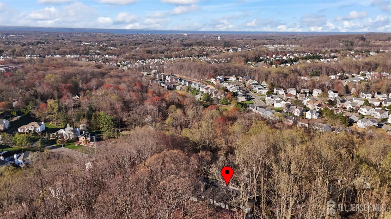 120 Nolan Road Morganville, NJ 07751 - Photo 74 of 85 an aerial view of residential houses with city and green space