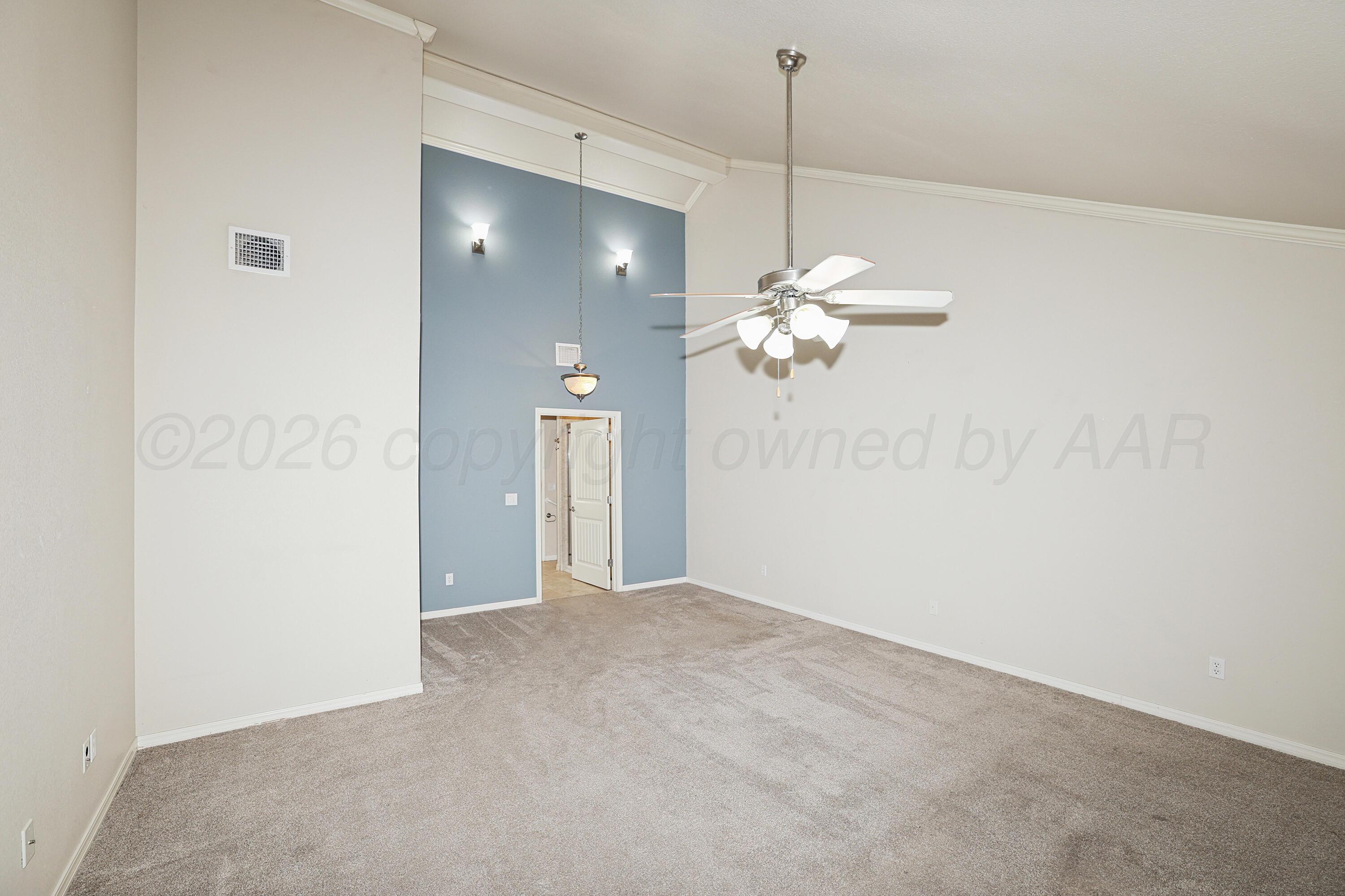 6709 Mosley Street Amarillo, TX 79119 - Photo 11 of 29 a view of a chandelier fan and a window
