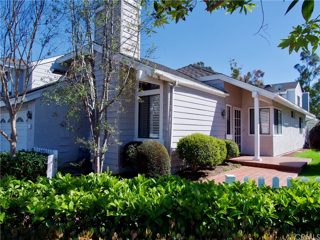 15 Robinsong, Unit 160 Irvine, CA 92614 - Photo 1 of 31 Front entry with white picket fence