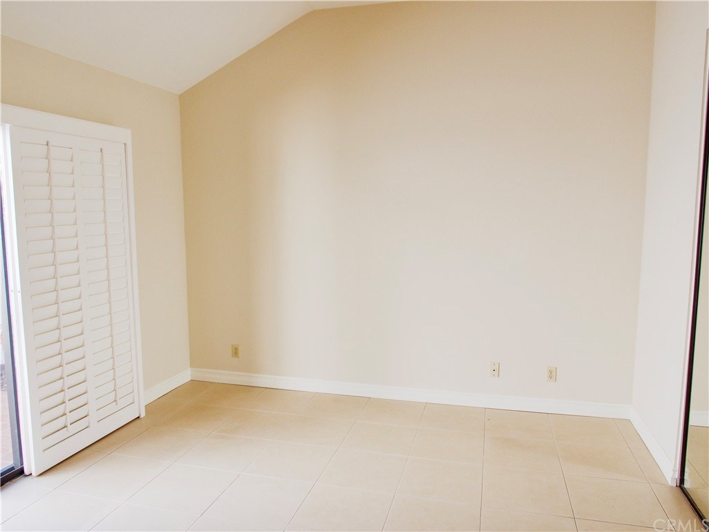 15 Robinsong, Unit 160 Irvine, CA 92614 - Photo 13 of 31 Master bedroom with sliding door leading to the private back patio