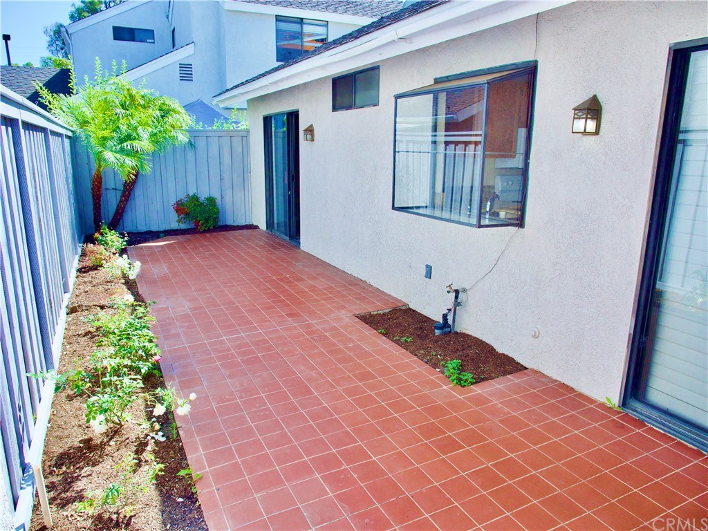 15 Robinsong, Unit 160 Irvine, CA 92614 - Photo 23 of 31 Tile back patio with access from the master bedroom, dining area and garage
