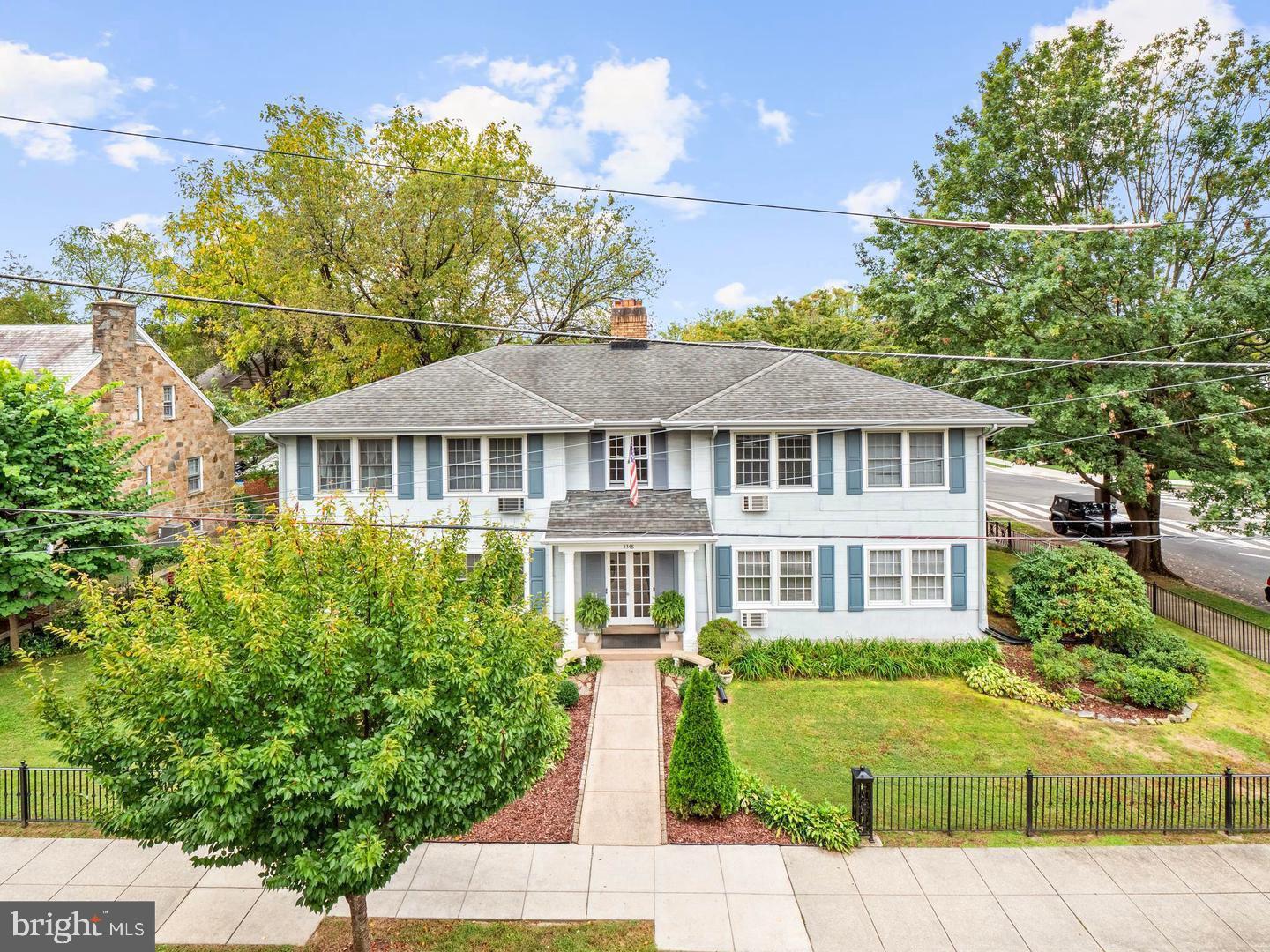 4348 Ellicott Street Northwest, Unit 3 Washington, DC 20016 - Photo 16 of 16 a front view of a house with a garden