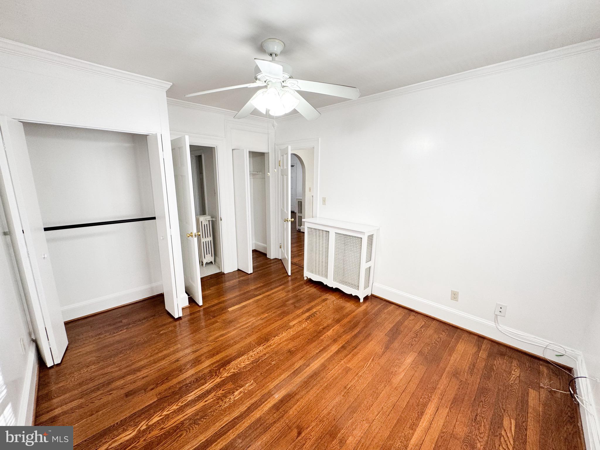 4348 Ellicott Street Northwest, Unit 3 Washington, DC 20016 - Photo 9 of 16 a view of empty room with wooden floor and fan