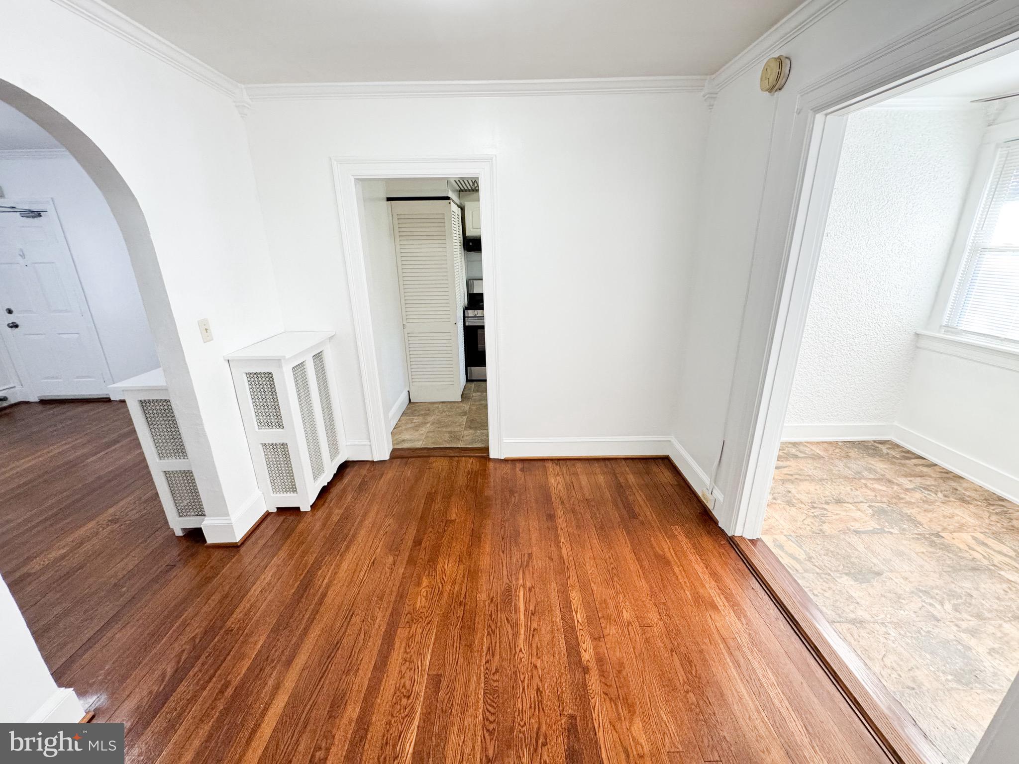 4348 Ellicott Street Northwest, Unit 3 Washington, DC 20016 - Photo 10 of 16 a view of a room with wooden floor and staircase