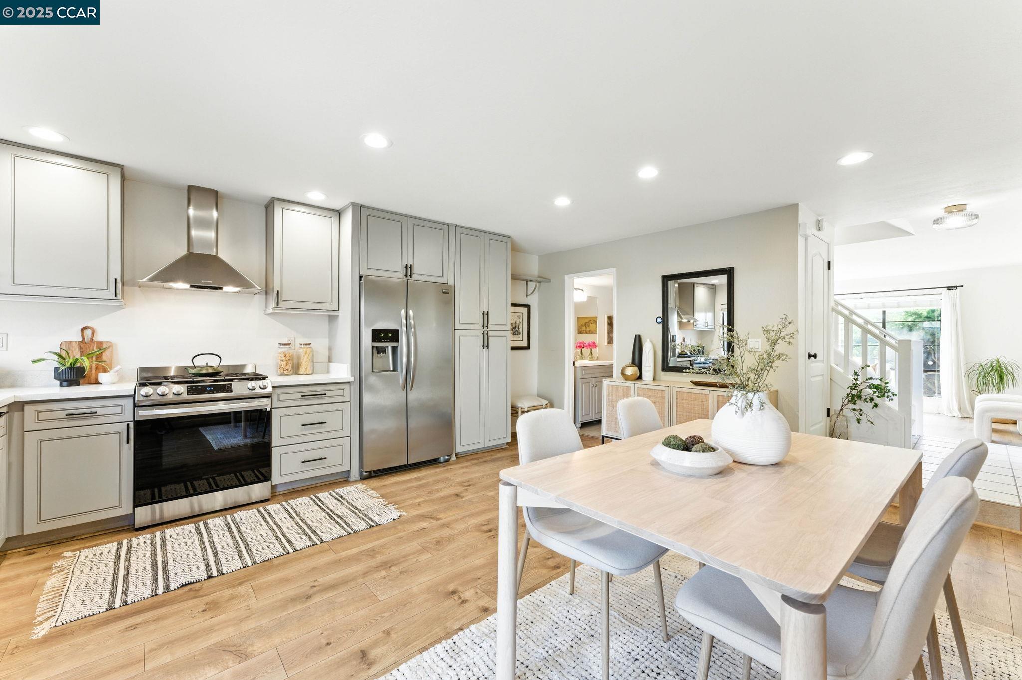 1660 San Luis Road Walnut Creek, CA 94597 - Photo 1 of 46 a kitchen with stainless steel appliances kitchen island granite countertop a kitchen island a stove a table and chairs
