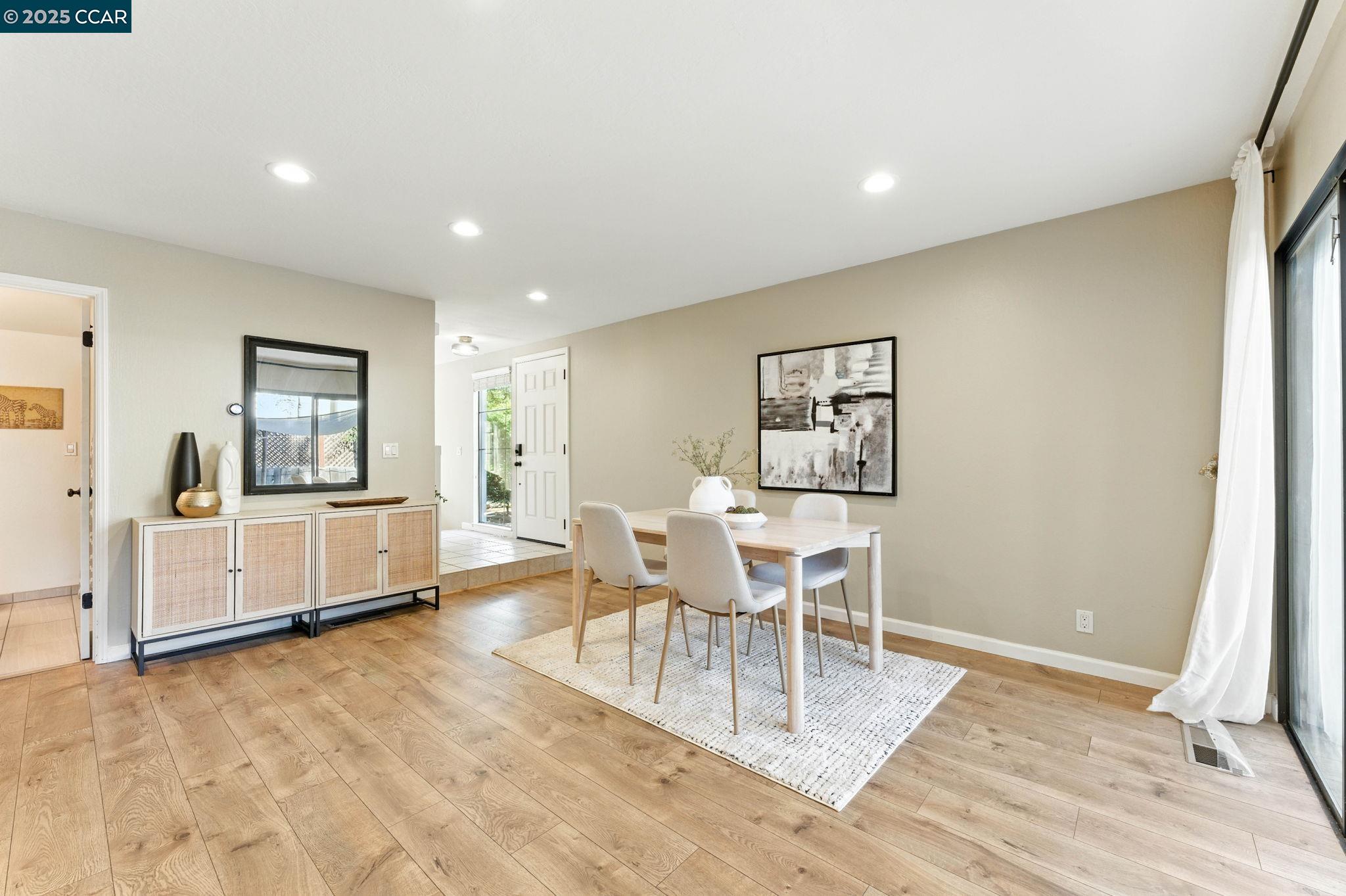 1660 San Luis Road Walnut Creek, CA 94597 - Photo 16 of 46 a dining room with wooden floor and a rug