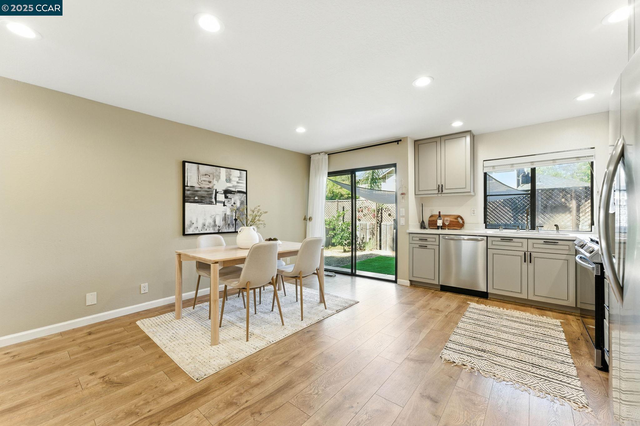 1660 San Luis Road Walnut Creek, CA 94597 - Photo 17 of 46 a living room with furniture a wooden floor and next to a window