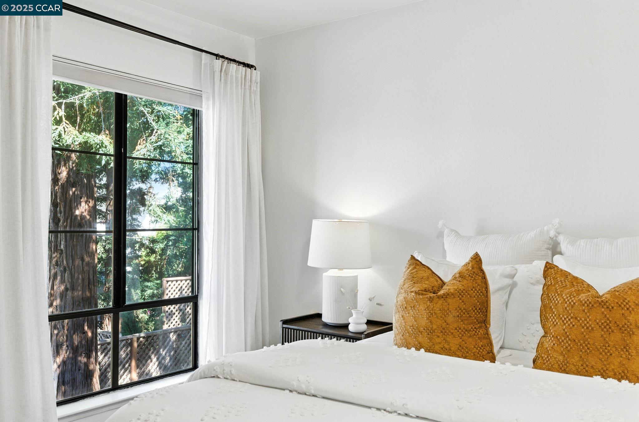 1660 San Luis Road Walnut Creek, CA 94597 - Photo 26 of 46 a bed room with a bed and a lamp