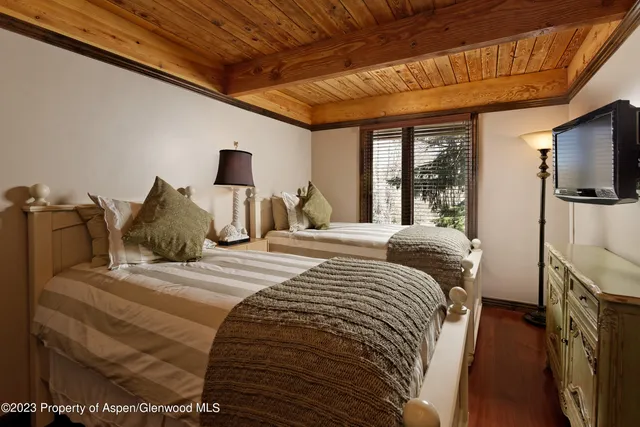 a bathroom with a granite countertop toilet sink and mirror